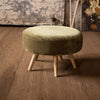 Another view of Kalalou Velvet Ottoman With Wooden Legs Avocado is the perfect addition to your home. Its versatility allows it to fit in with any style, and its beautiful construction is perfect for displaying books or using as a footrest.(SKU# tb1). This table is available in Coffee Table Mart now.