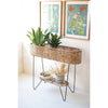 Kalalou Looking for a stylish and organic way to display your plants? Look no further than our Large Oval Seagrass And Iron Planter! This beautiful planter is perfect for a sunny indoor spot or outside area, and features plenty of room for a variety of plants or herbs. (SKU# tb1) in another angle. This table is available in Coffee Table Mart now.